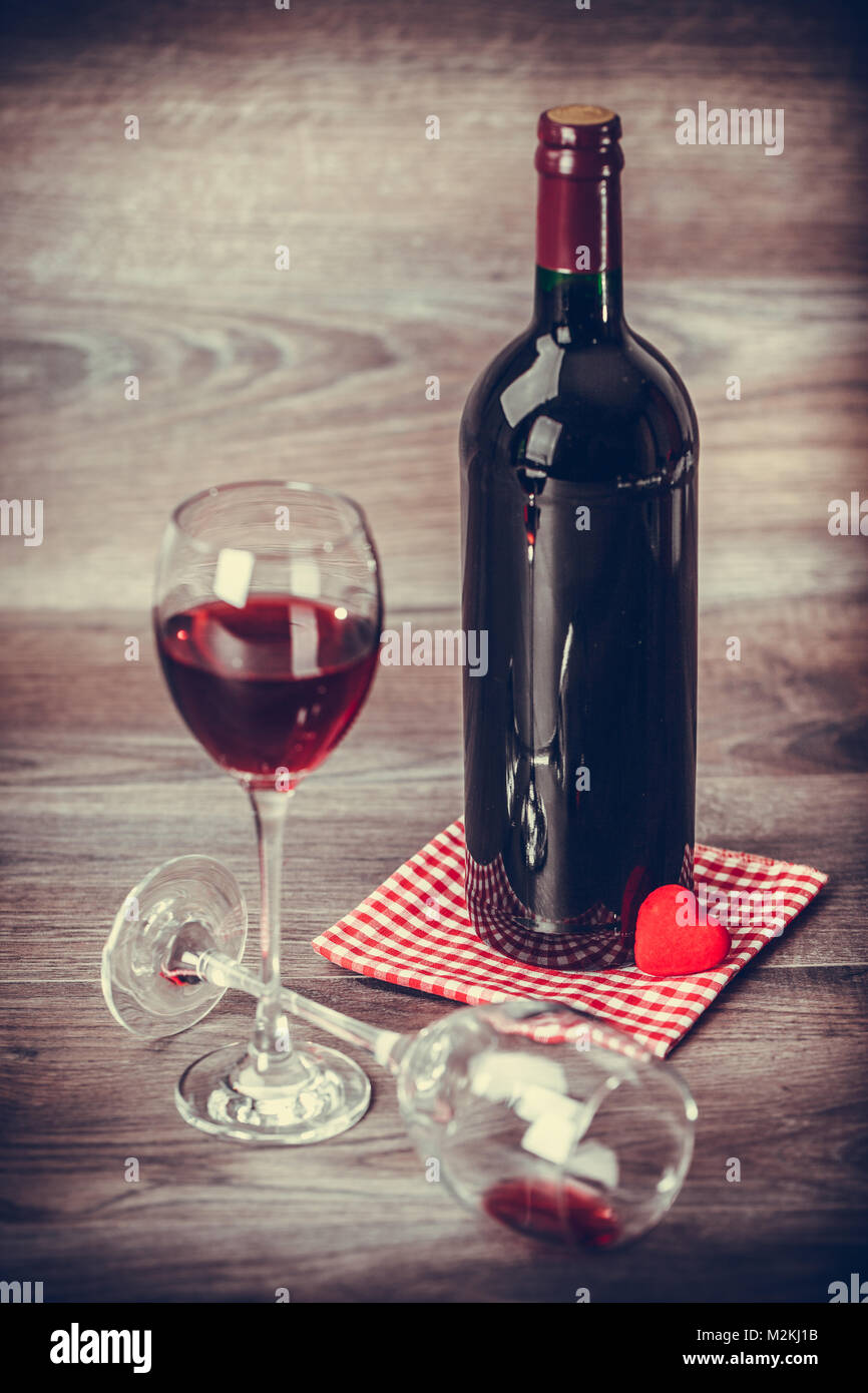 Red Wine Bottle Two Glasses Of Wine With Decoration By Red Hearts