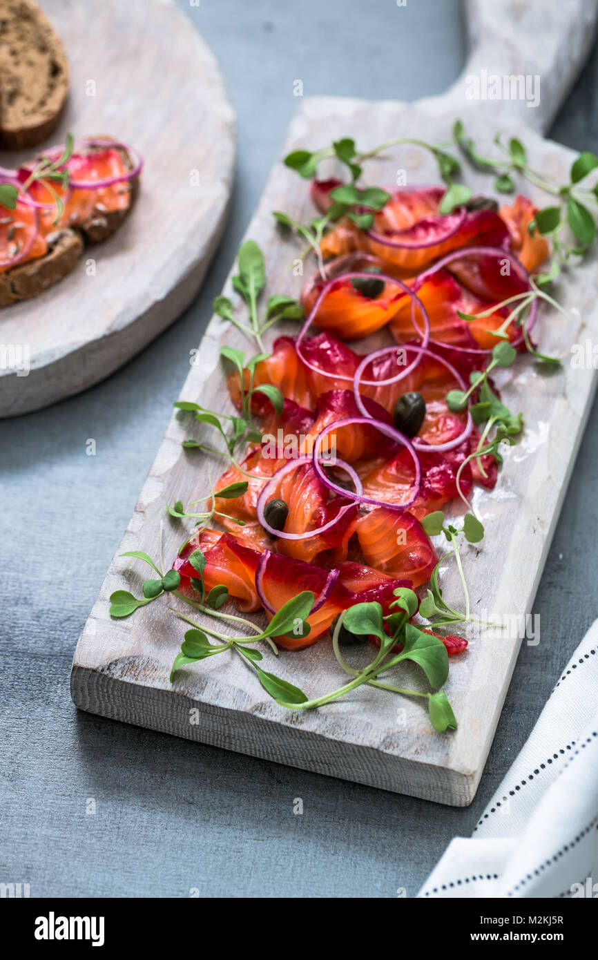 Close view of sliced gravlax, marinated salmon with salt, vodka and