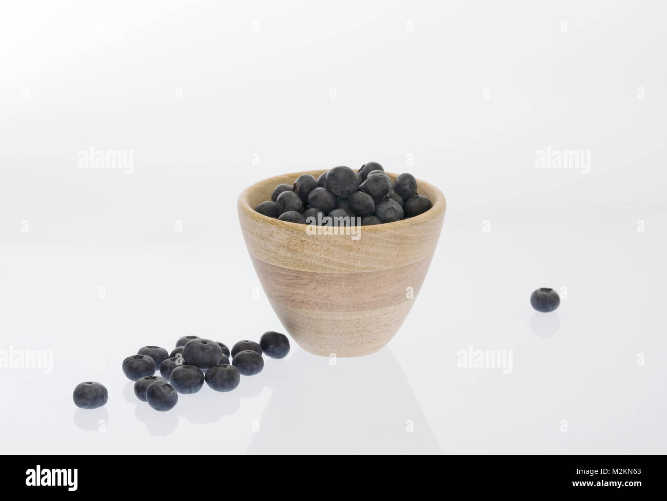 Vaccinium corymbosum. Blueberries in a wooden pot. Stock Photo