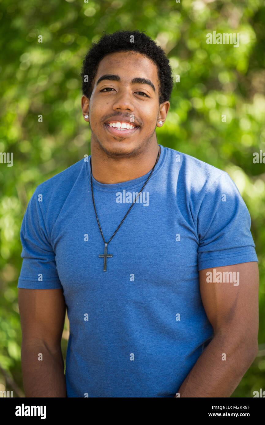 African American teenage boy smiling Stock Photo - Alamy
