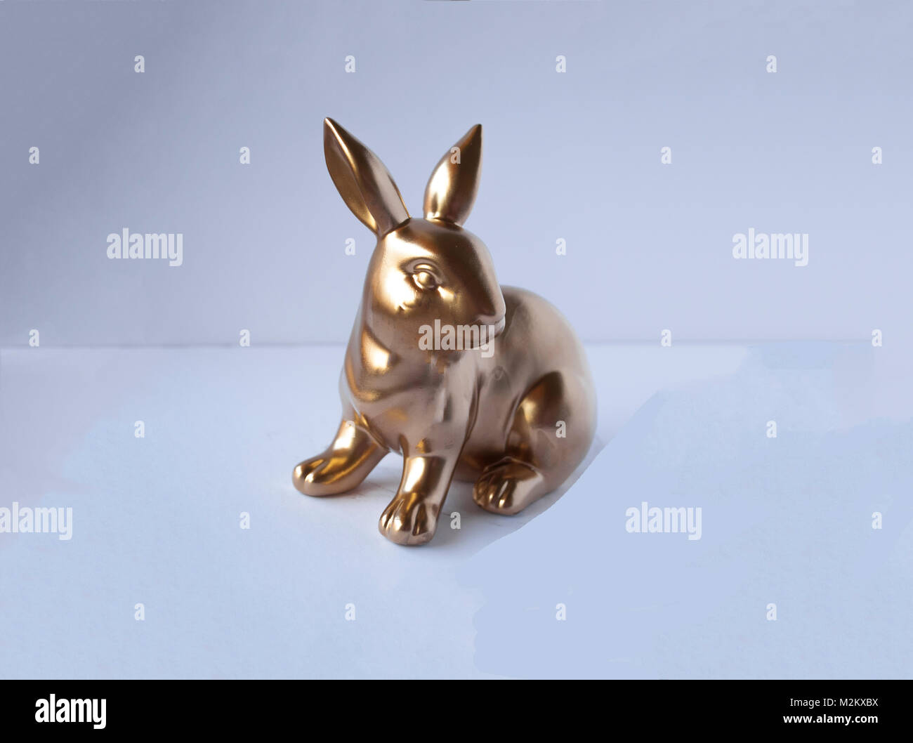 Easter golden bunny isolated on green close up Stock Photo