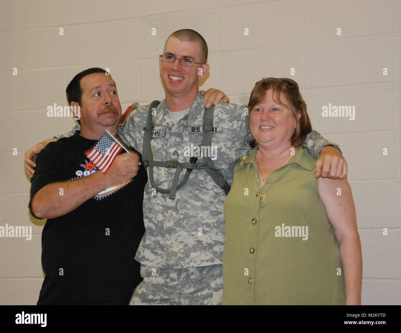 MINDEN, La. –Louisiana National Guardsman Sgt. Travis L. Hahn of the 1083rd Transportation Company, 165th Combat Sustainment Support Battalion, stands with his parents at a deployment ceremony at the Minden Civic Center in Minden, La., May 27.  The 1083rd will be deploying for a year in support of Operation Iraqi Freedom.  (U.S. Army Photo by Sgt. Beyonka D. Joseph, Louisiana National Guard State Unit Public Affairs Representative) Louisiana Guardsmen deploy in support of Operation Iraqi Freedom by Louisiana National Guard Stock Photo