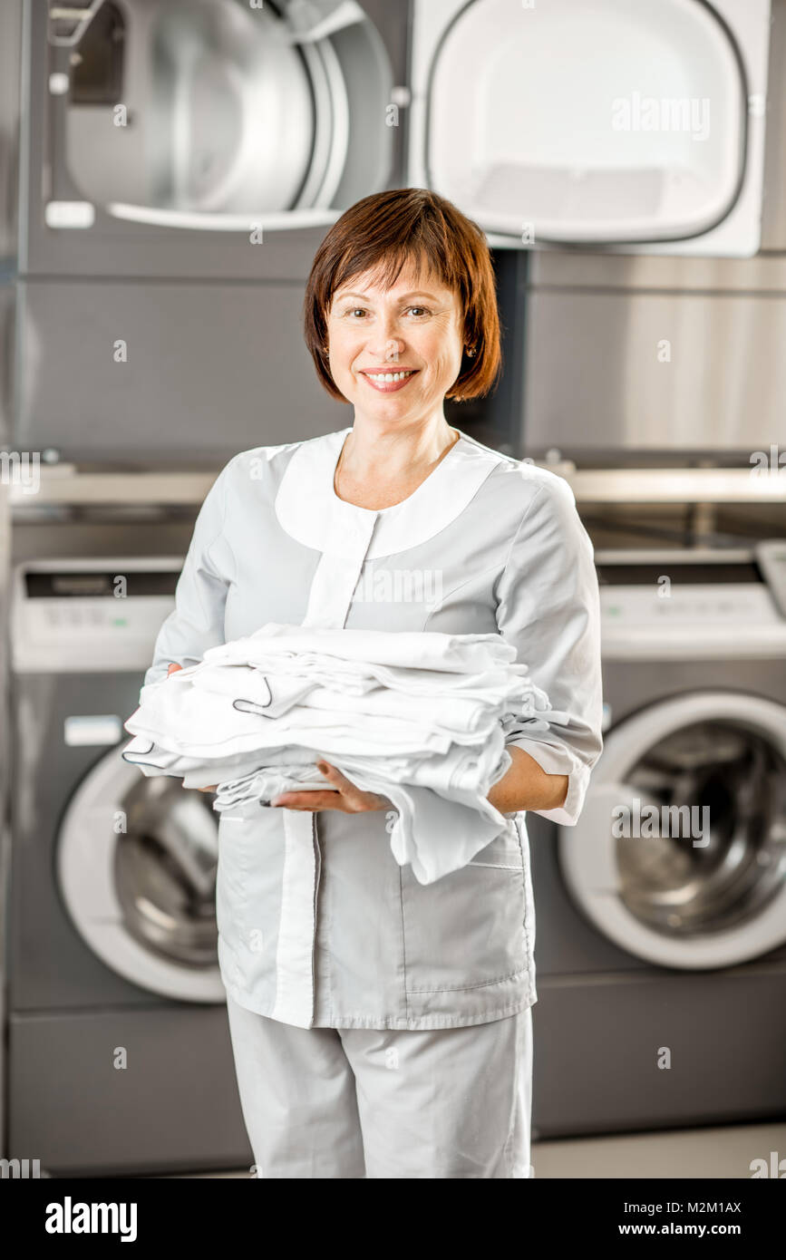 https://c8.alamy.com/comp/M2M1AX/senior-washwoman-in-the-laundry-M2M1AX.jpg