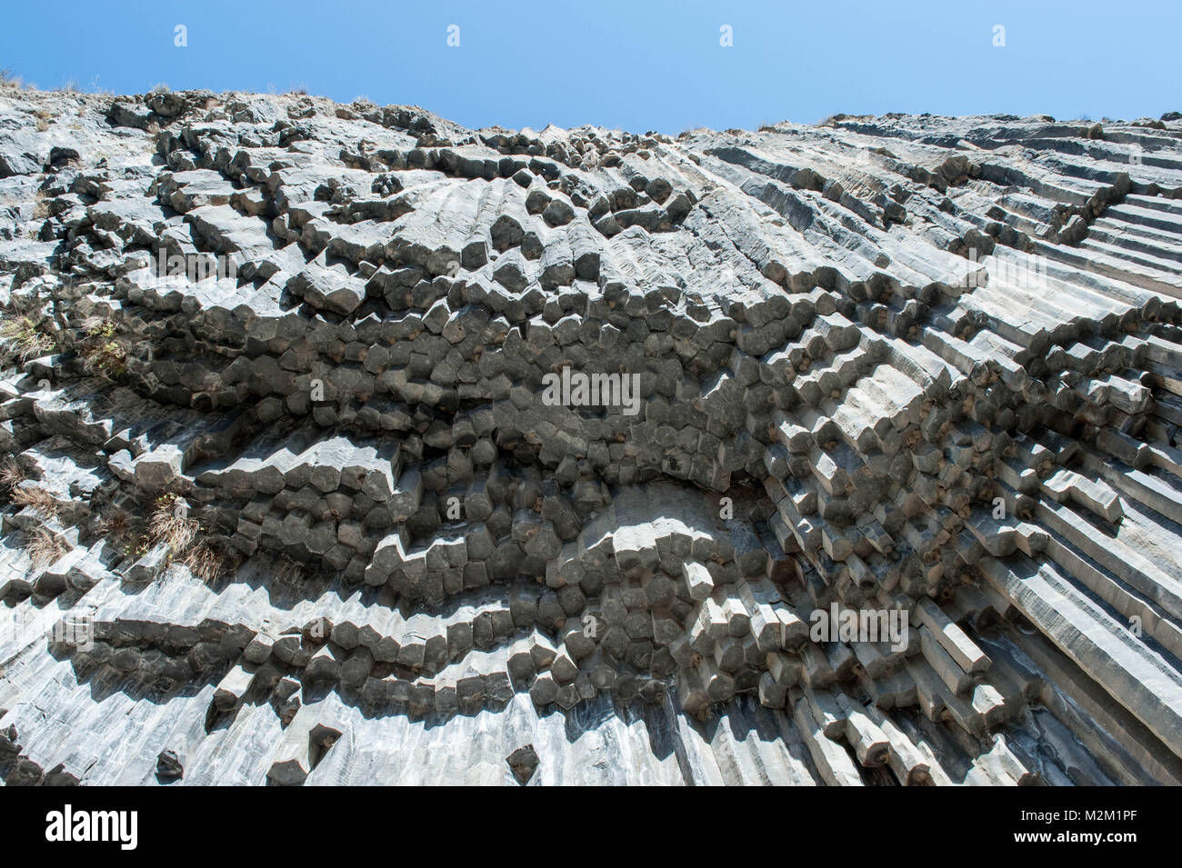 Along the sides of the Garni gorge are cliffs of basalt columns, carved out by the Goght river. Stock Photo