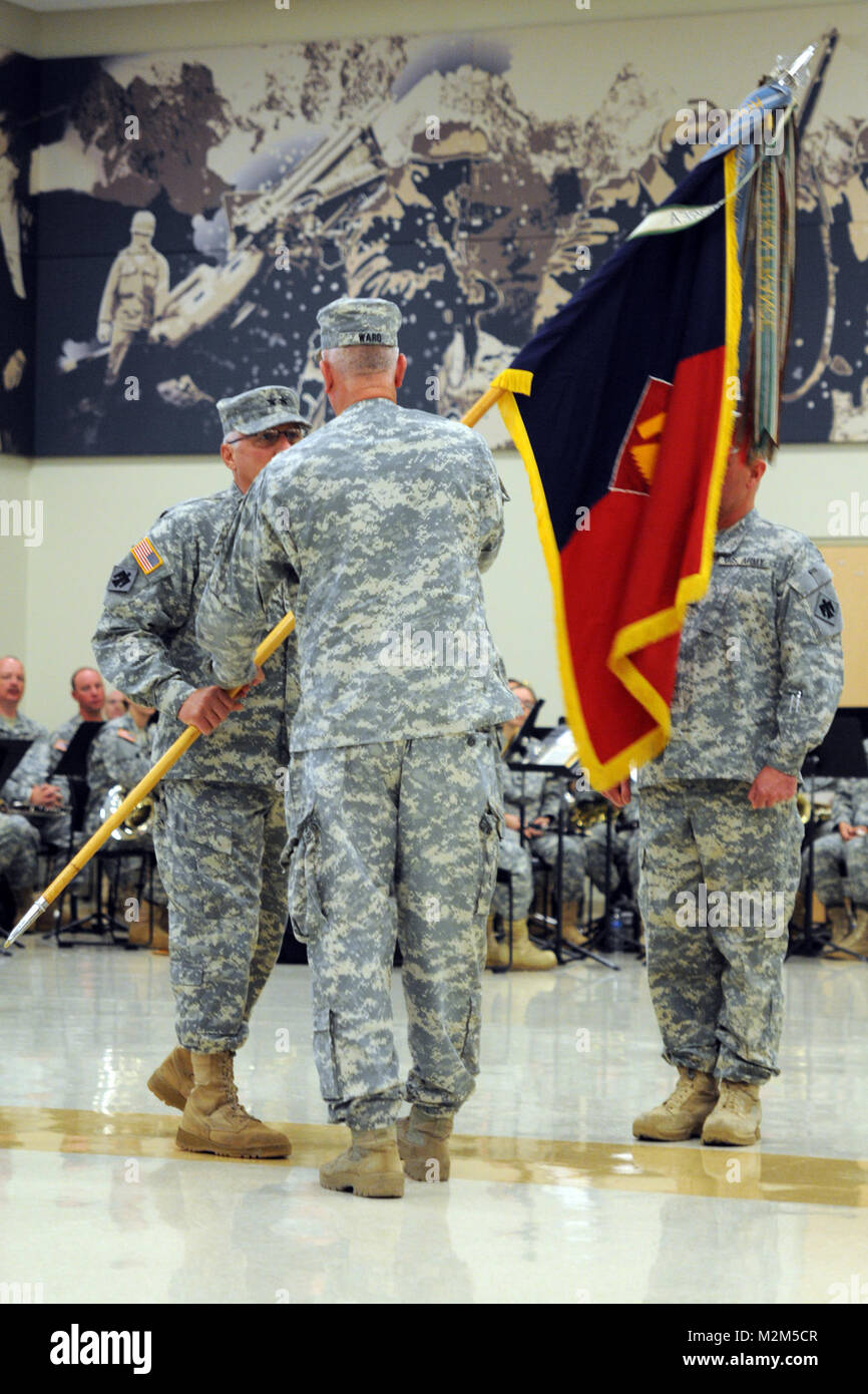 Col. Joel Ward passes the 45th Infantry Brigade Combat Team guideon to ...