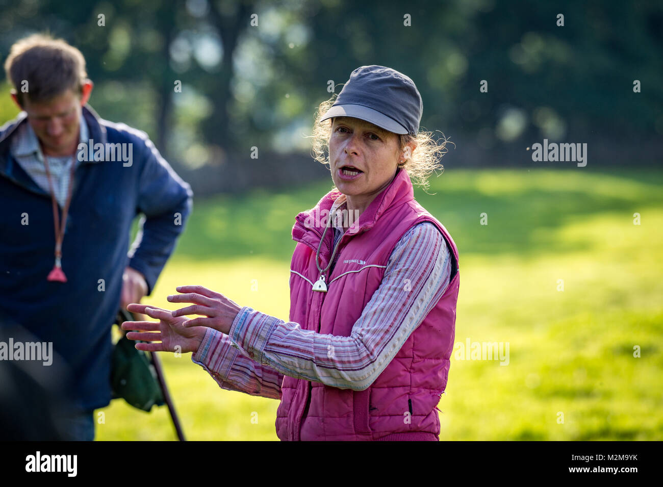 Portrait of female shepherd giving directions, Yorkshire Dales, UK Stock Photo