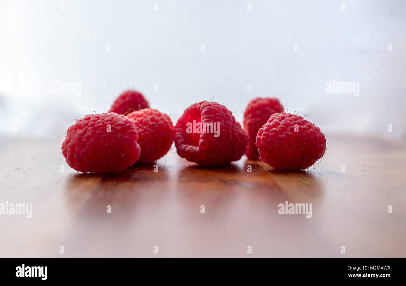 Cut Up Raspberry fresh raspberries on cutting board Stock Photo - Alamy
