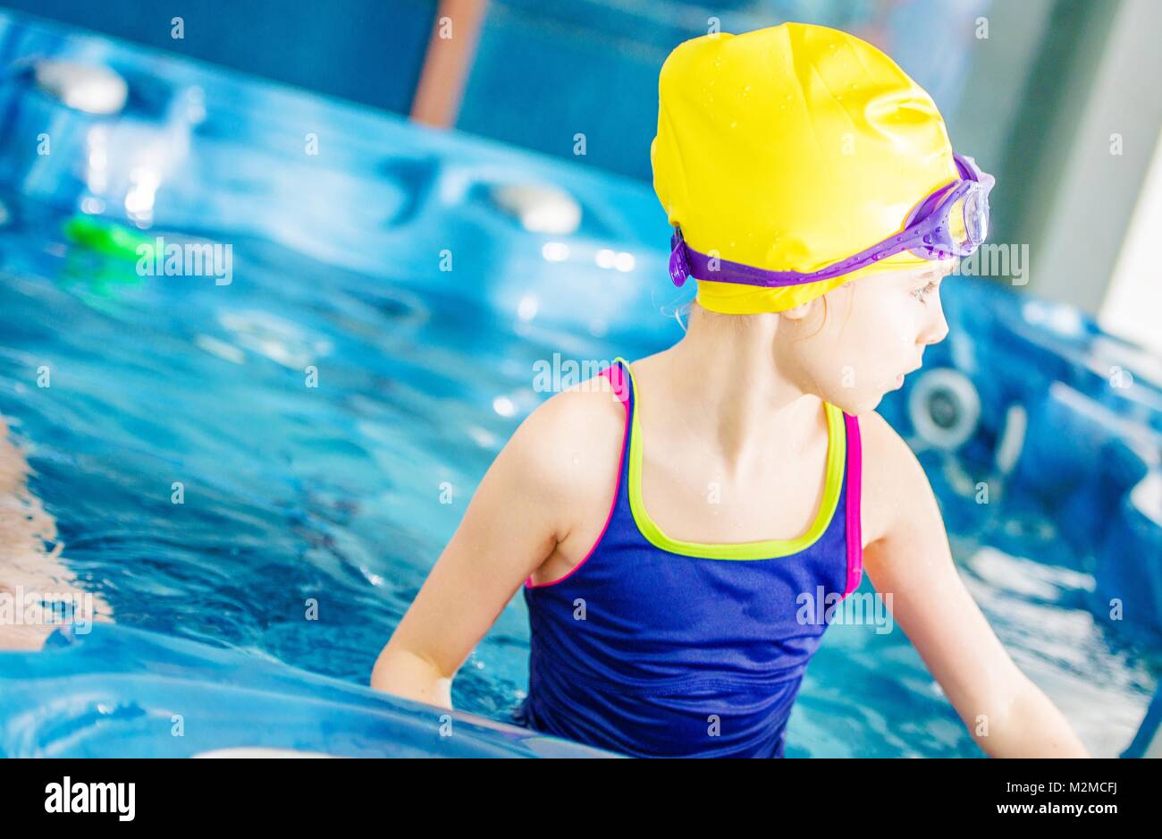 Little Caucasian Girl Having Fun in the Jacuzzi. Children Recreation