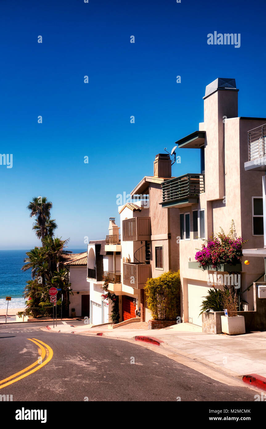 Modern homes lining a street near Manhattan Beach California on a sunny