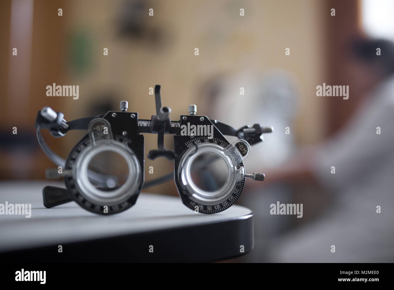 Close up of a phoropter inside the optical, ophthalmologist in a blurred background. tool for ophthalmologists Stock Photo