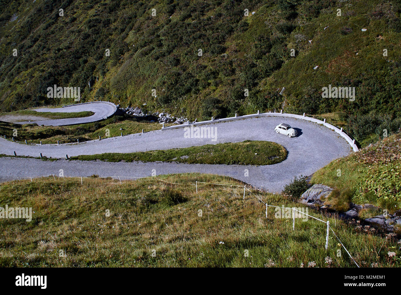 VW-Käfer cruising up the Via Tremola Stock Photo