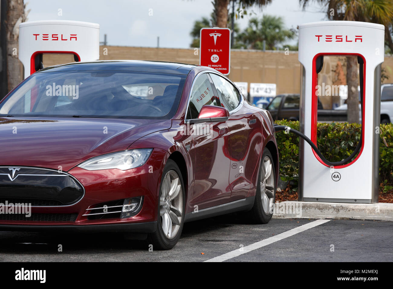 Tesla being charged, electric car vehicle charging station, Florida