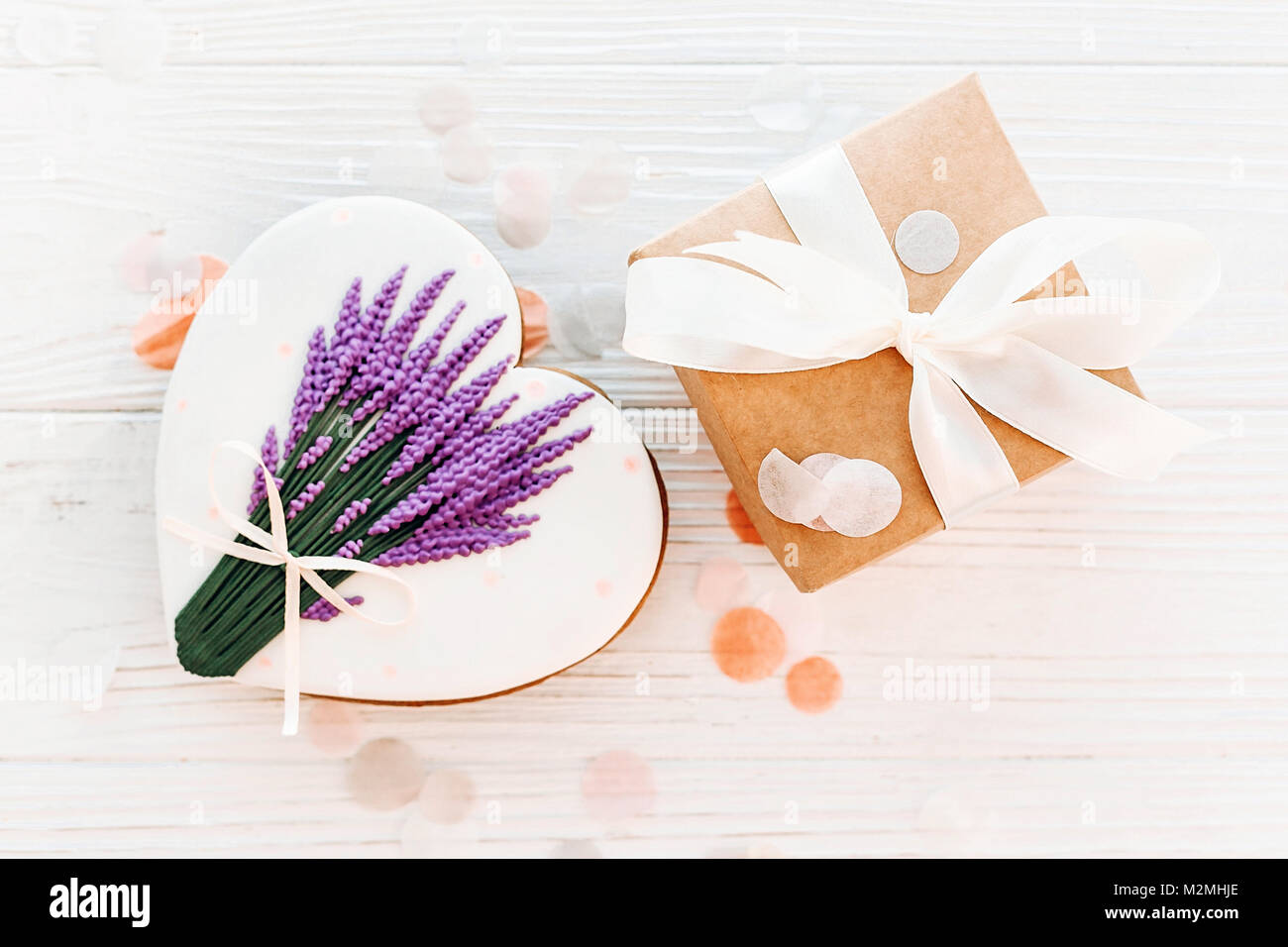 happy mother's day greeting card. cookie heart with lavender flowers and  craft gift box on white rustic wood background flat lay. space for text.  hap Stock Photo - Alamy