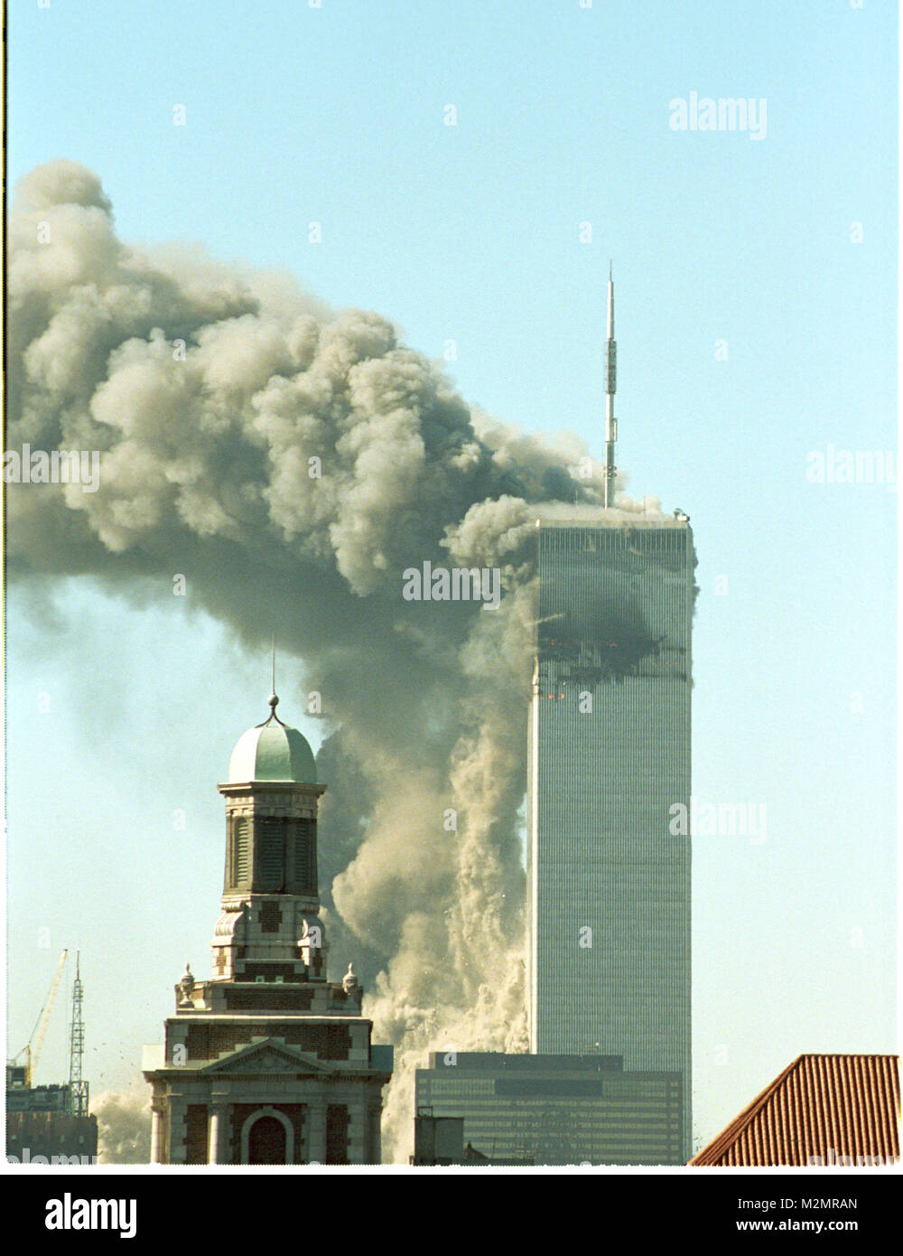 World Trade Center Attack photos taken from 14 street on a rooftop as the towers burn and one is falling Stock Photo