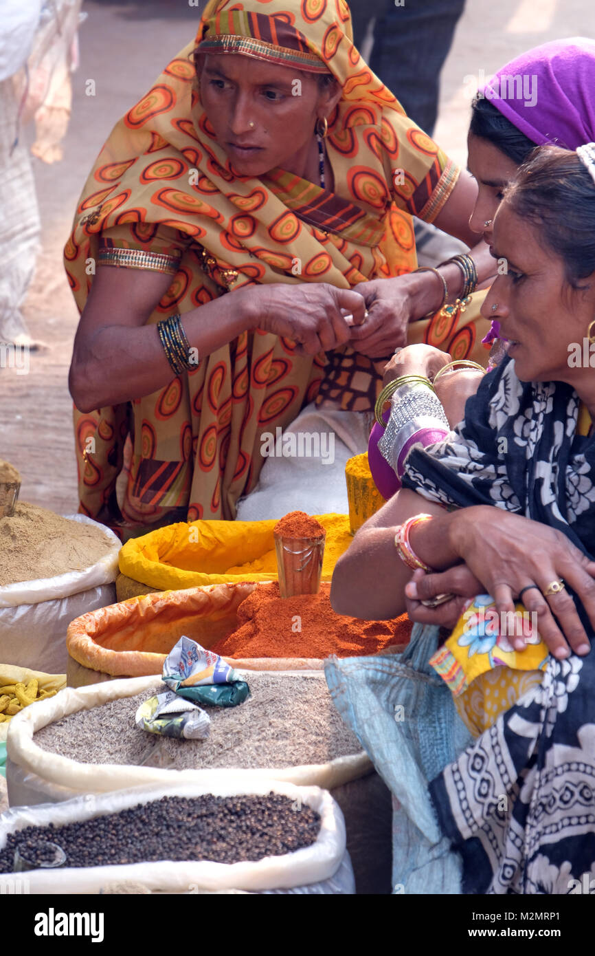 Indian women buying spices at street market, India Stock Photo
