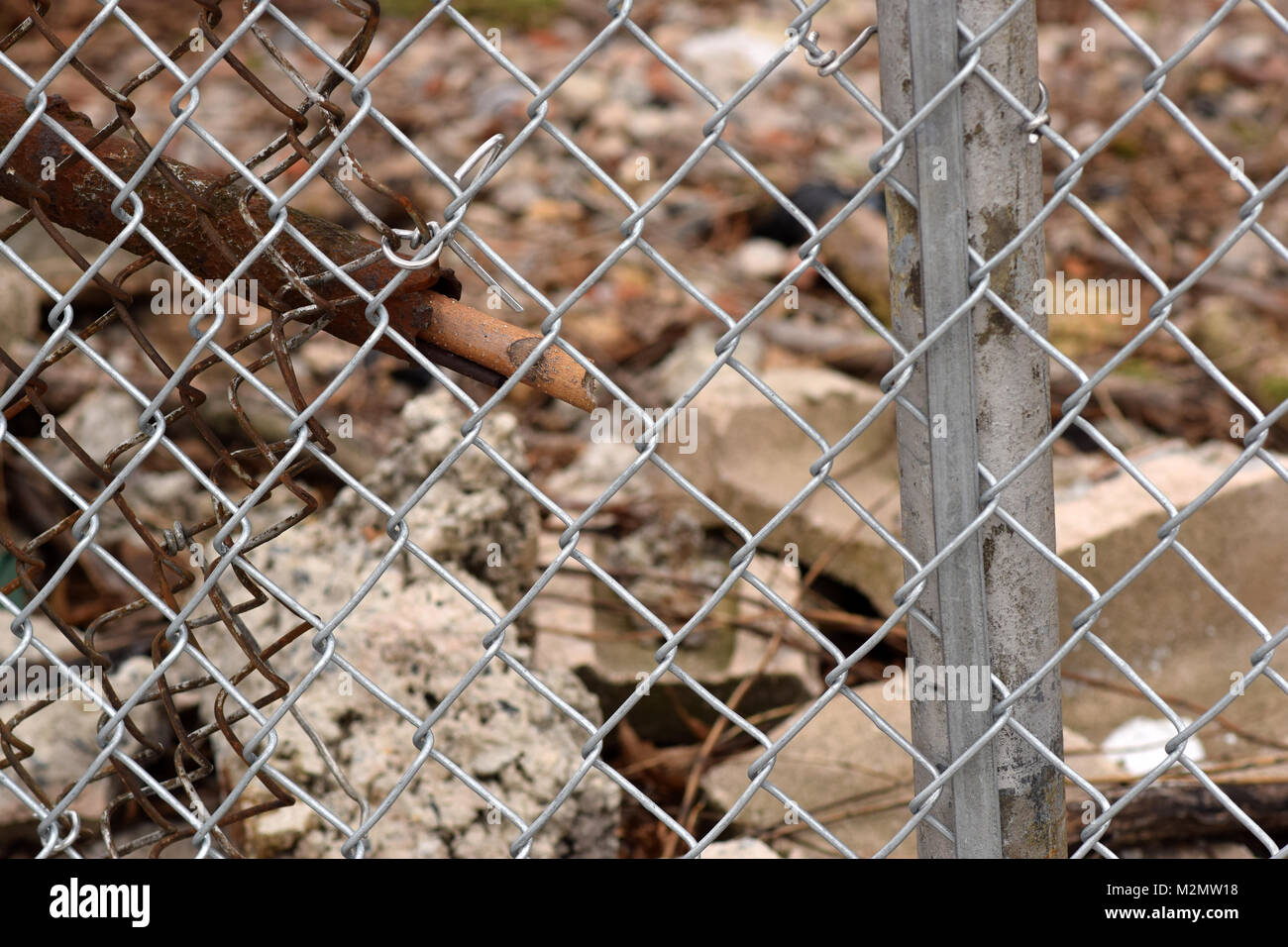 Rusty Chain Link Fence With A Brown And Grey Urban Background Blurred ...