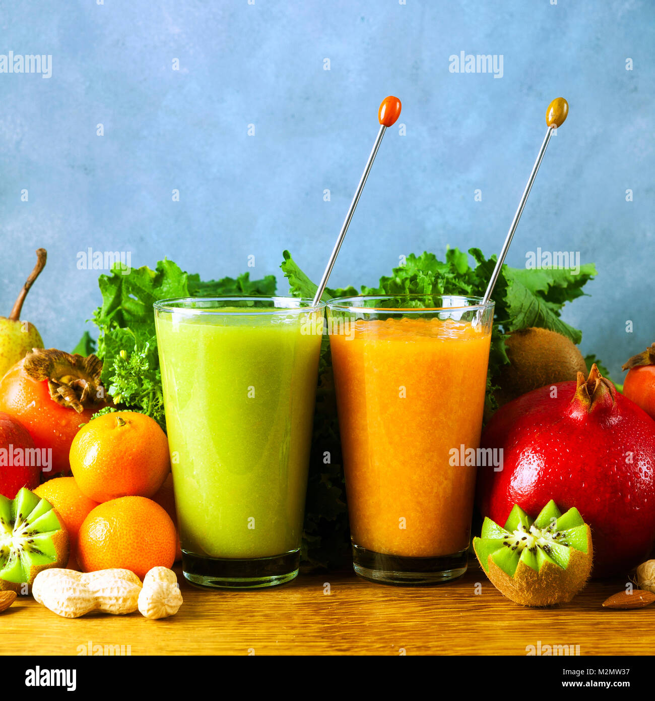 Freshly blended fruit smoothies of various colors and tastes in glass