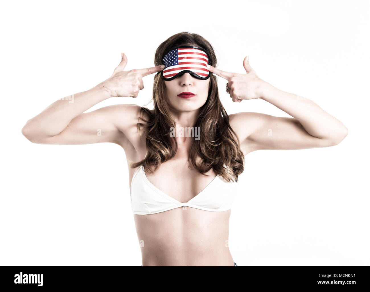 Young woman wearing eyemask. American Dream concept. Isolated on white background. Toned Image. Stock Photo