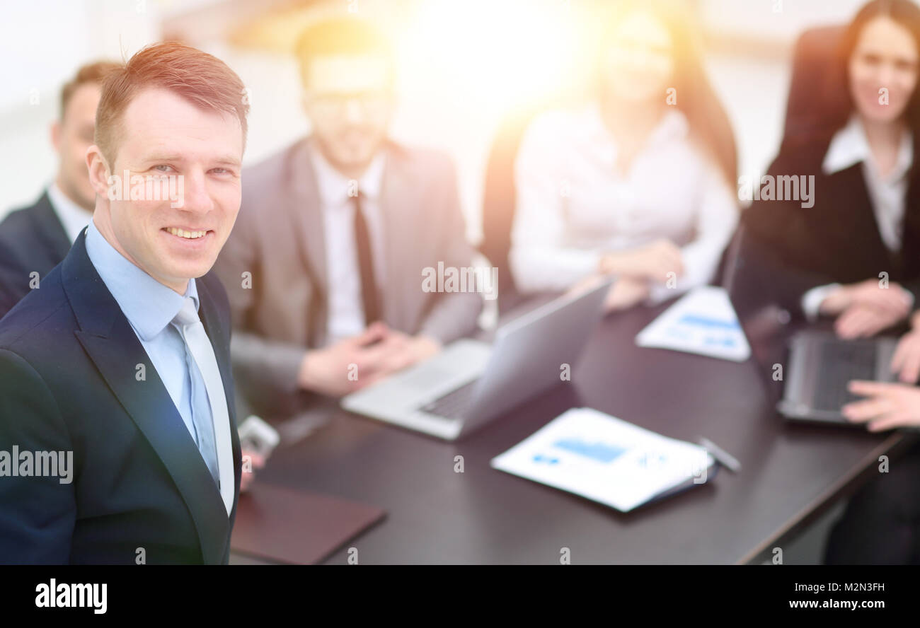project Manager on the background of business team Stock Photo - Alamy
