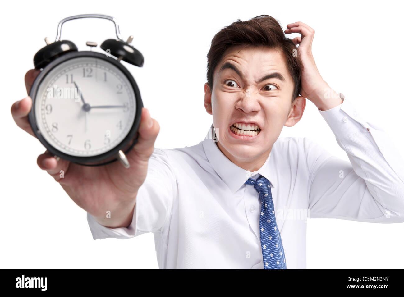 Expression of pain business young man with an alarm clock Stock Photo ...