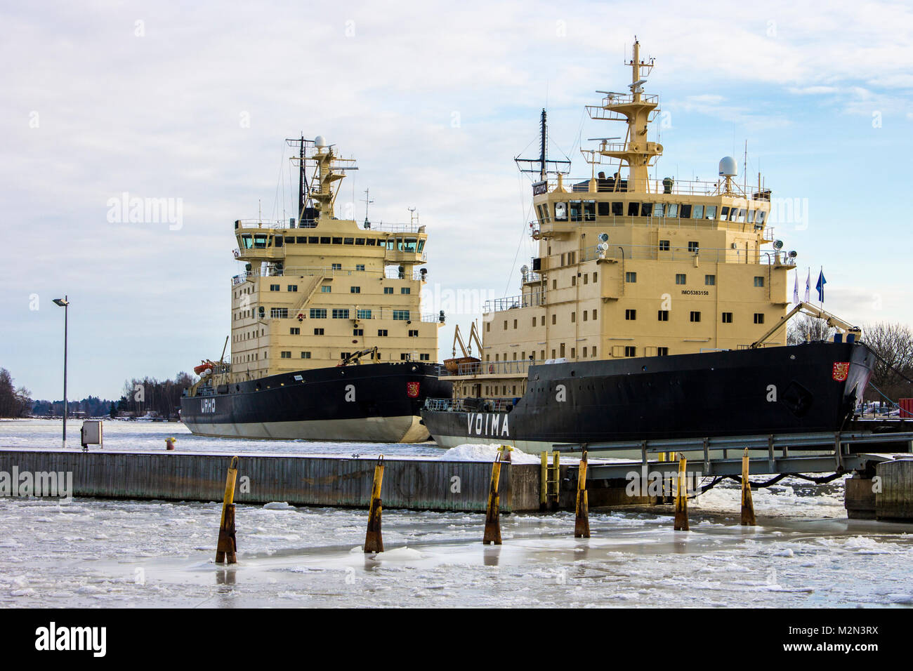 Voima and Urho, two State-owned Diesel-electric icebreakers of the Finnish Fleet in the island of Katajanokka, Helsinki, Finland Stock Photo