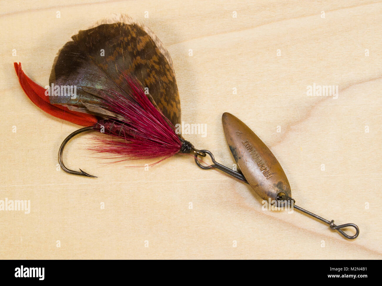 White Miller Bass Fly - unknown Hook: ring-eye bass hook. Size No.2/0 Tail:  quill, dyed red Body: wound white chenille Hackle: white saddle Head: bla  Stock Photo - Alamy