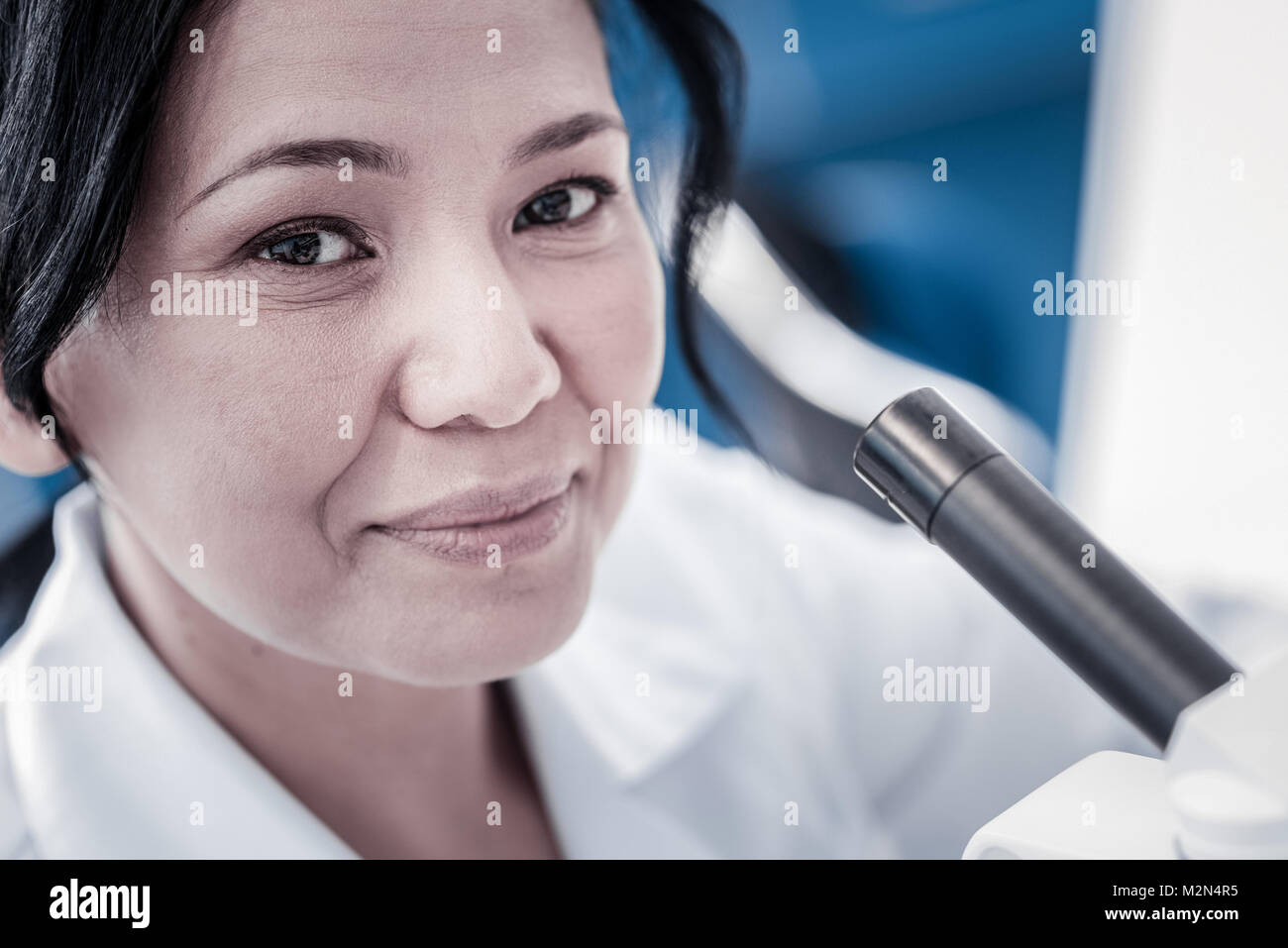 Close up portrait of cheerful female researcher Stock Photo