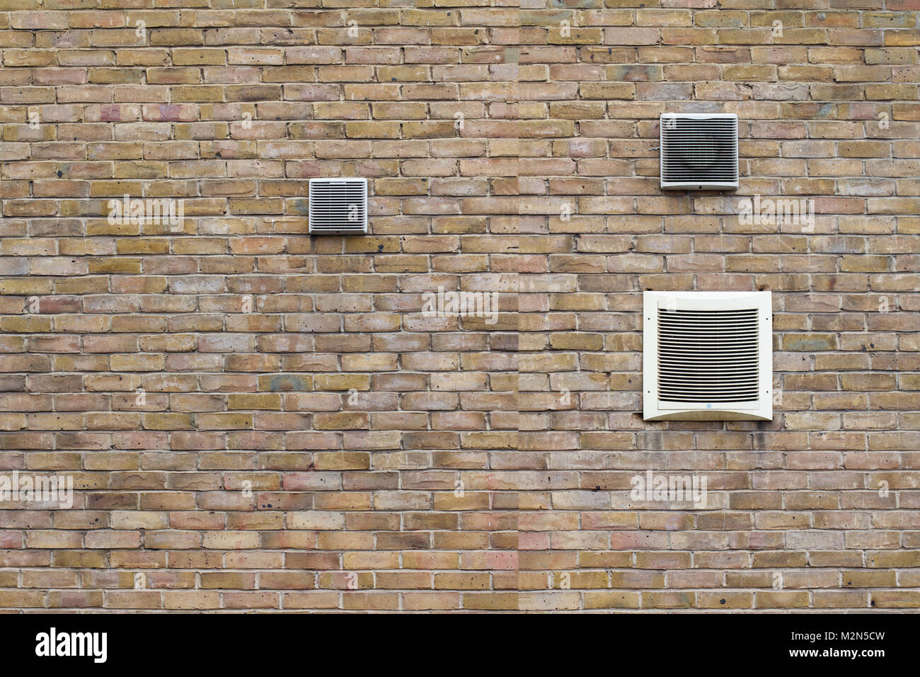 horizontal front view of air conditioning vents of different sizes on