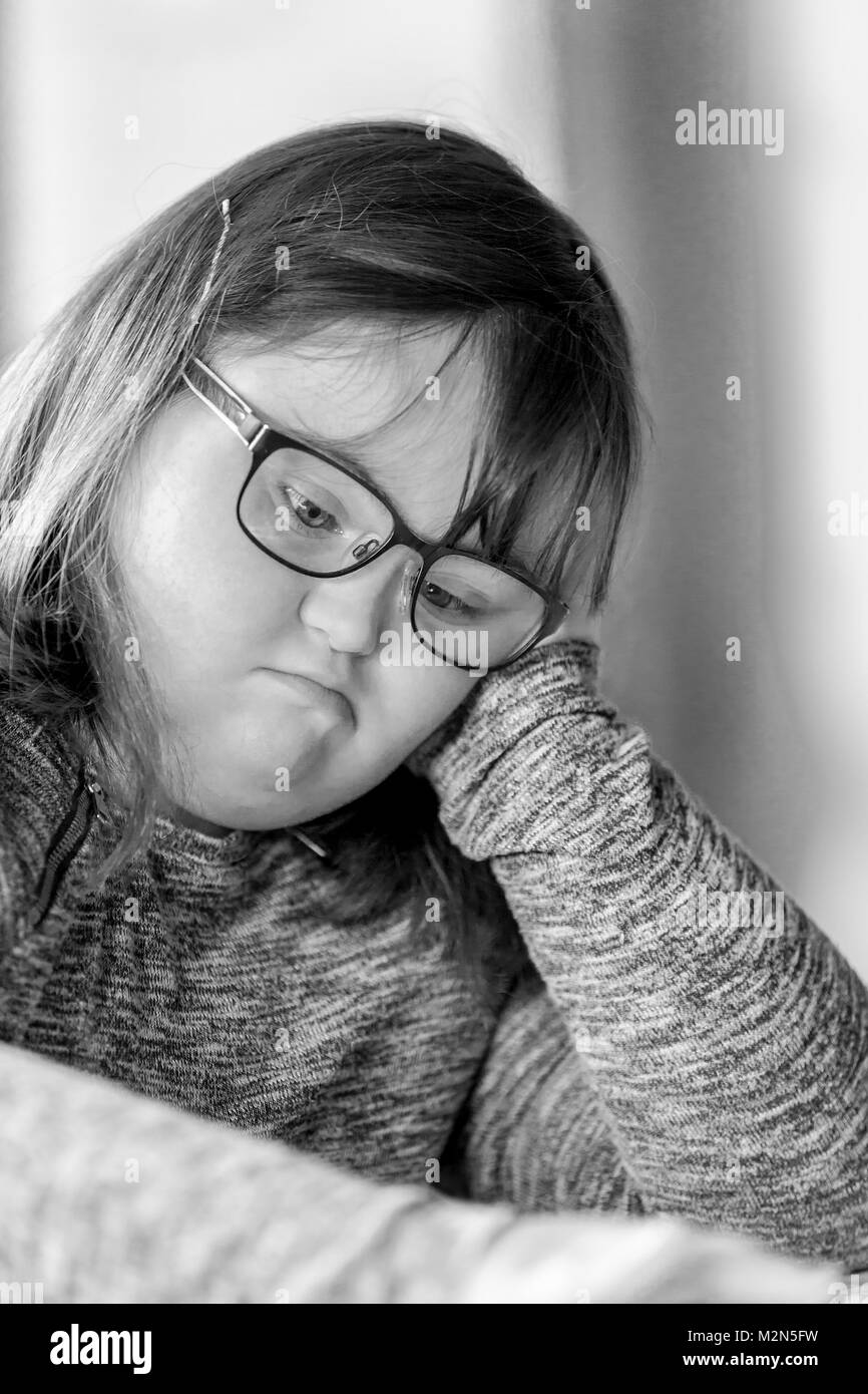 Happy child with downs syndrome always ready to help Stock Photo Alamy