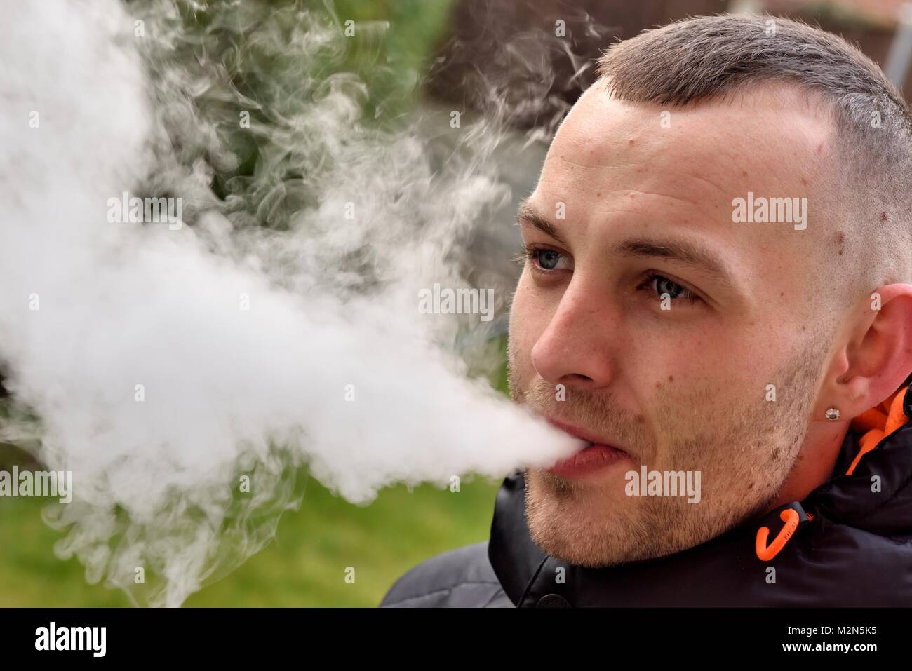 A 27 year old man vaping UK Stock Photo