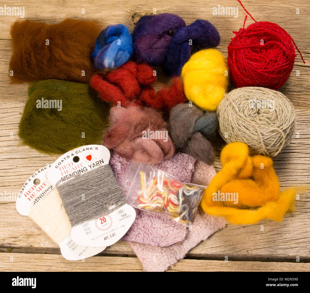 Sheep and Lambs Wool Wool from sheep and lambs can be dyed in any number of colors. It readily absorbs water and makes a great dubbing. Stock Photo