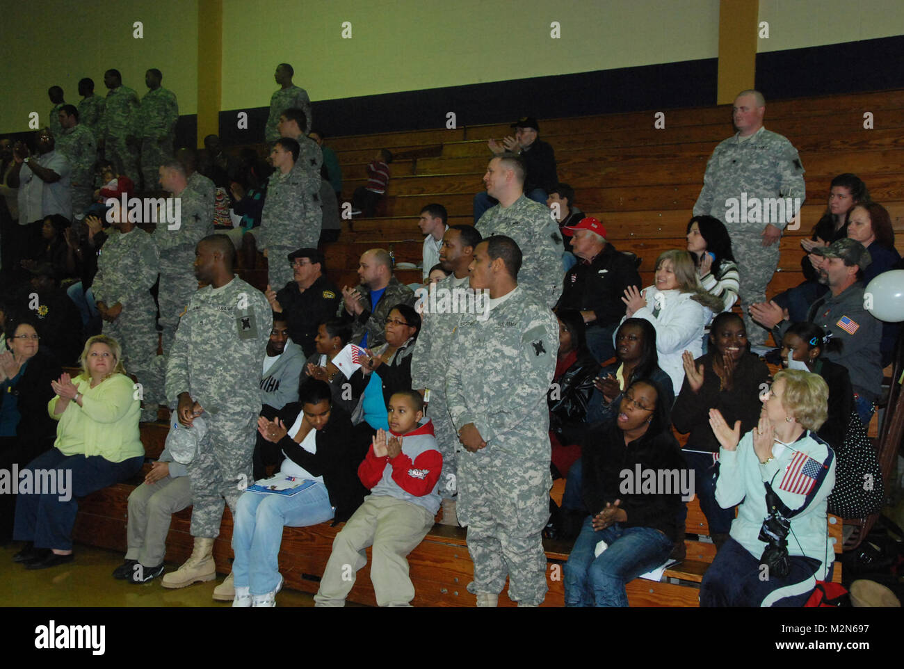 JEANERETTE, La. - Soldiers of the Louisiana Army National Guard's E Company, 199th Brigade Support Battalion, of the 256th Infantry Brigade Combat Team, bid farewell to family and friends at a deployment ceremony at Jeanerette High School in Jeanerette, La., Jan. 7.  (U.S. Army Photo by Sgt. Michael L. Owens, Louisiana National Guard State Unit Public Affairs Representative) 100107-A-0635O-046 by Louisiana National Guard Stock Photo