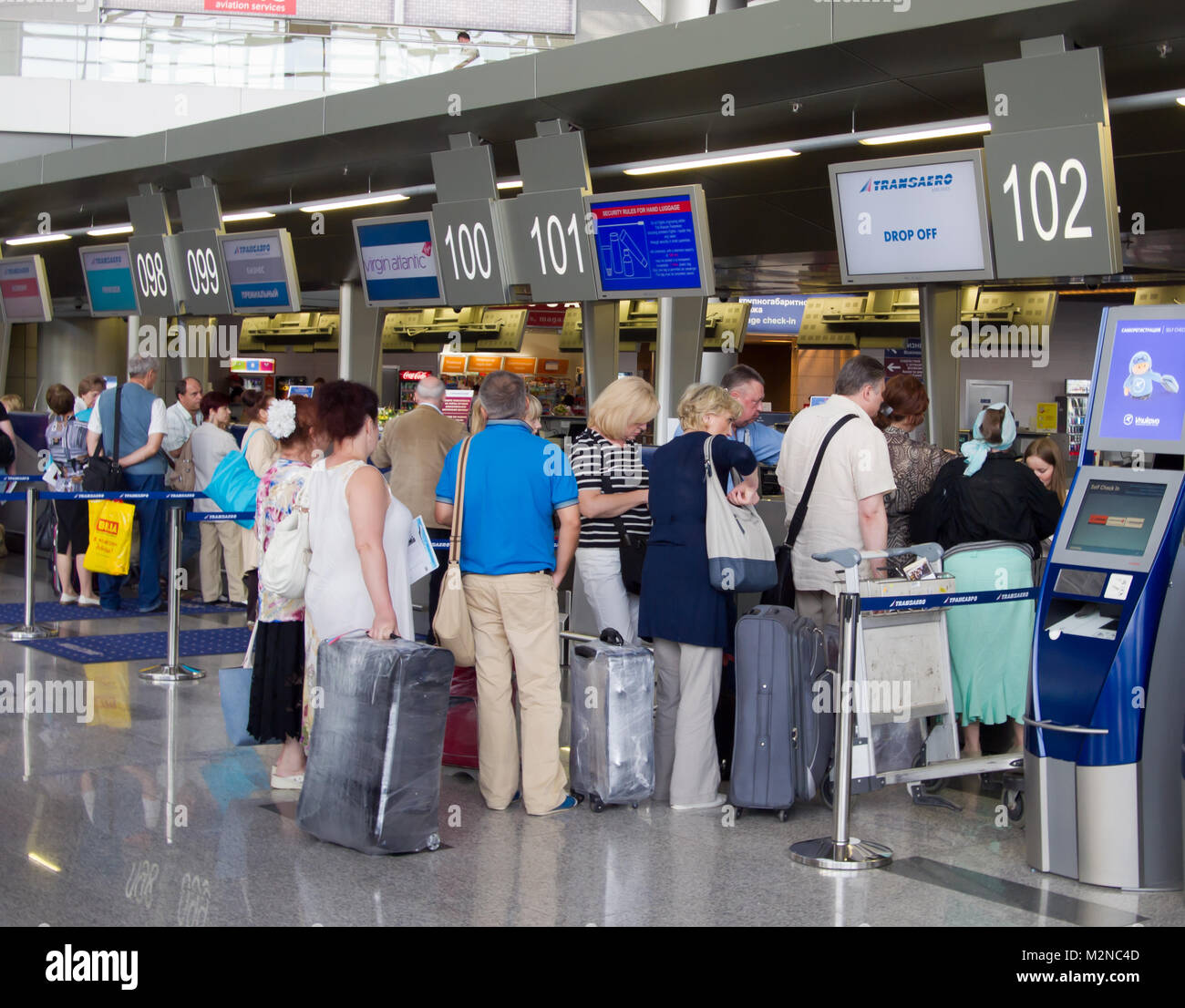 Moscow, Russia - May 16, 2013: The queue of people in the booking office Vnukovo Airport Stock Photo