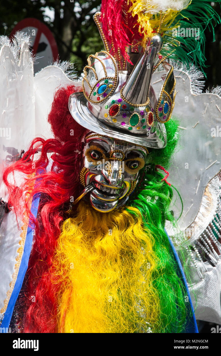 Bolivian costume with a silver mask at Carnaval del Pueblo, South American carnival  festival and parade in London, England, United Kingdom Stock Photo - Alamy