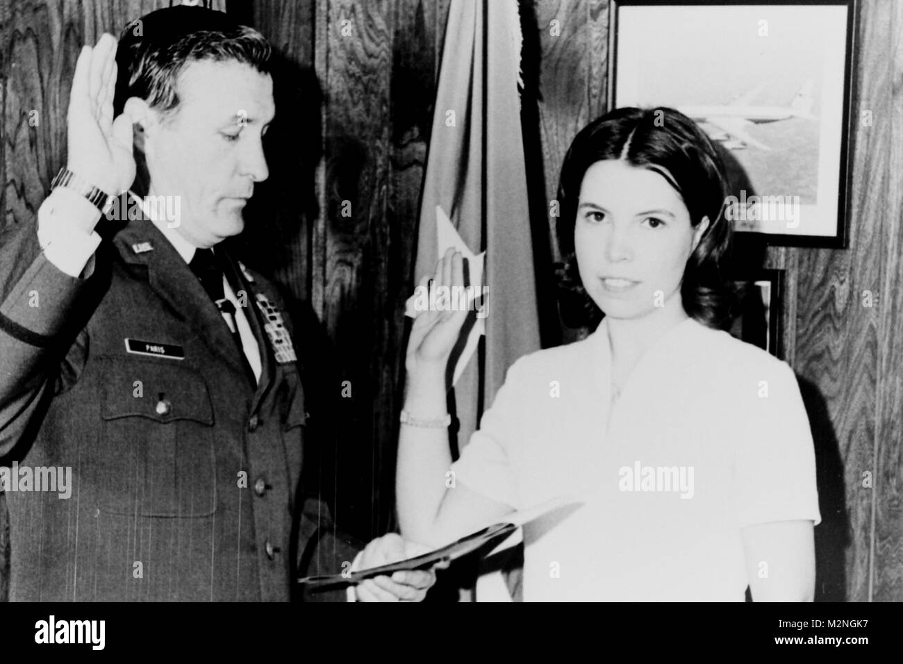 ATLANTA, My 17, 1973 - The Georgia National Guard's first female enlisted member, Pvt. Gail Wagner of Lithonia, takes the oath of enlistment from Maj. Gen. Joel Paris III, Georgia's Adjutant General.  Wagner is married to SP5 Robert D. Wagner, a member of the 166th Light Maintenance Company of Atlanta.  After basic traiing, Pvt. Wagner will join Neadquarters and Headquarters Detachment in Atlanta. First Female Enlistee by Georgia National Guard Stock Photo