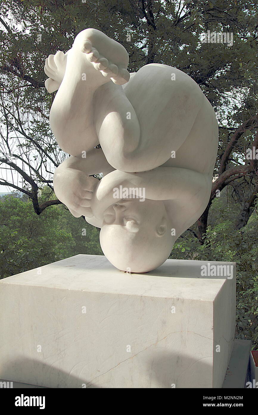 Sintra, Portugal - April 29, 2014: Baby upside down, statue in marble in Sintra, Portugal Stock Photo