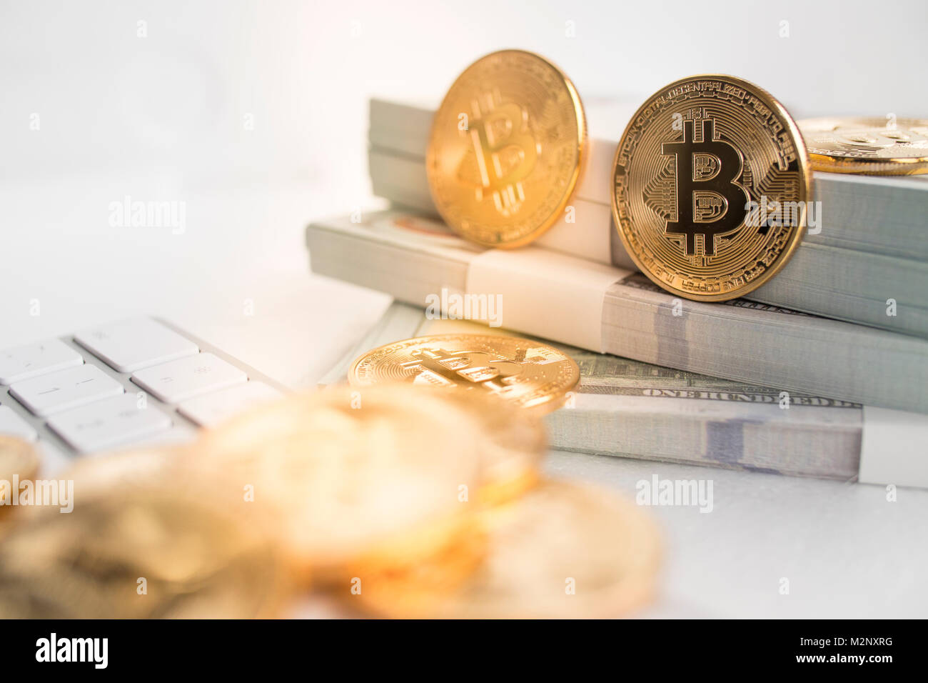 Bitcoin with little figure on keyboard Stock Photo - Alamy
