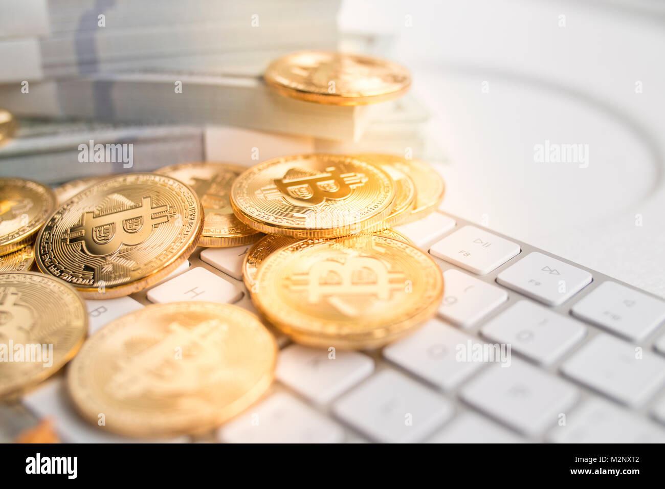 Bitcoin with little figure on keyboard Stock Photo - Alamy