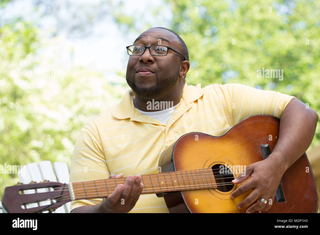 African American man playing a guitar Stock Photo - Alamy