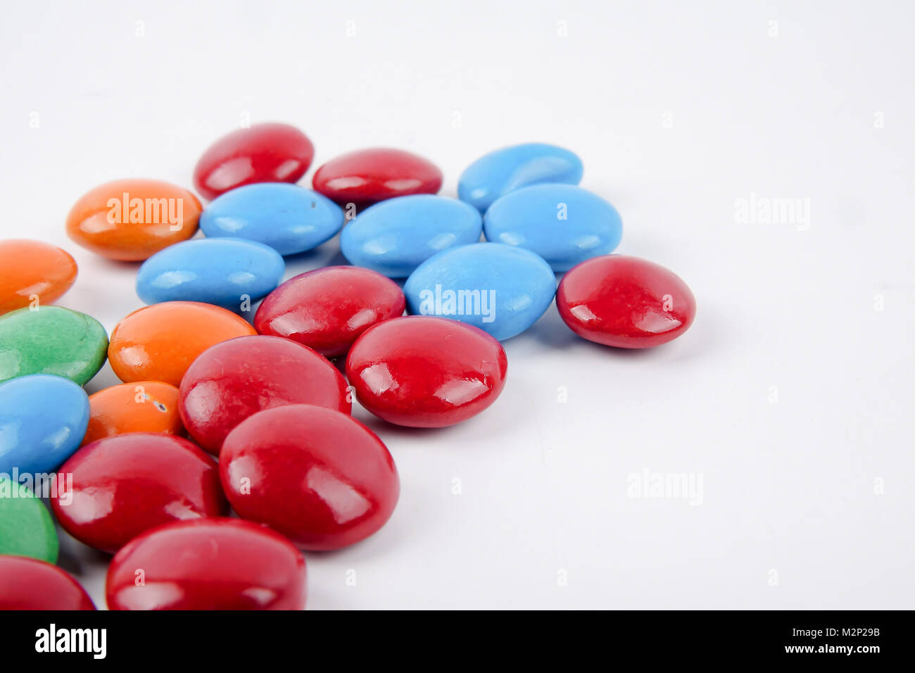 Colorful candy on a white background Stock Photo - Alamy