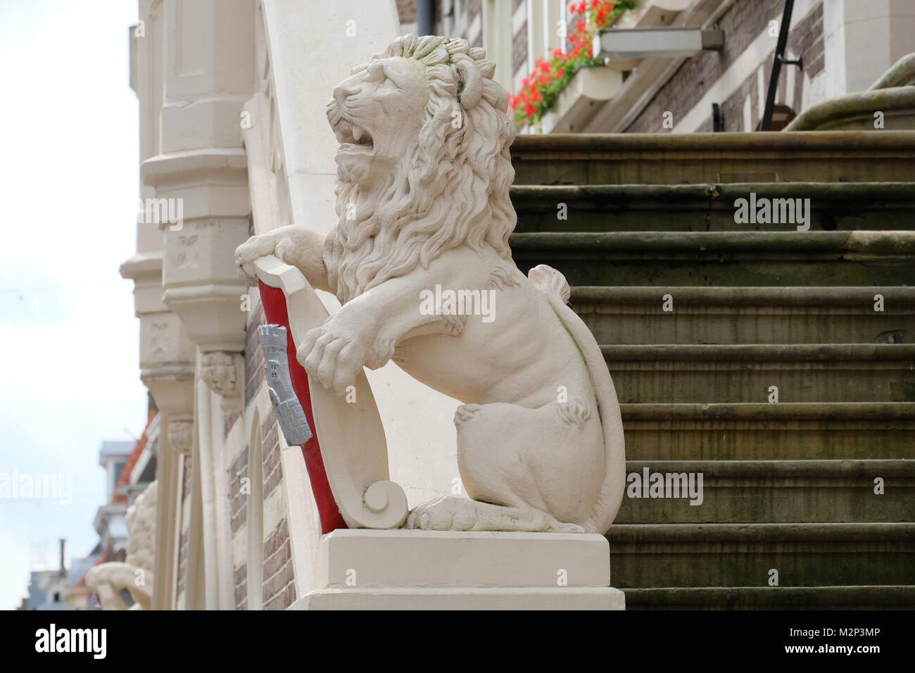 A Lion Guards a Building in Old Town Alkmaar, Home of the Dutch Summer Cheese Market Stock Photo