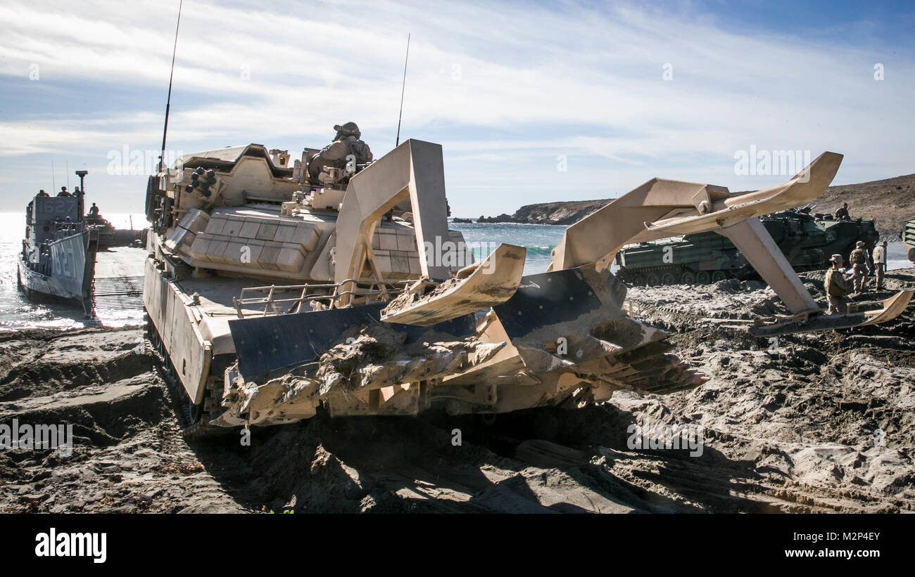 U.S. Marines from 1st Combat Engineer Battalion, 1st Marine Division, conduct the first amphibious landing in an Assault Breacher Vehicle with a Modified Full Width Mine Plow prototype during Exercise Steel Knight on the west coast. Marine Corps Systems Command tested the prototype which will make it easier to transport the ABV from ship to shore. (U.S. Marine Corps photo by Lance Cpl. Rhita Daniel) Stock Photo