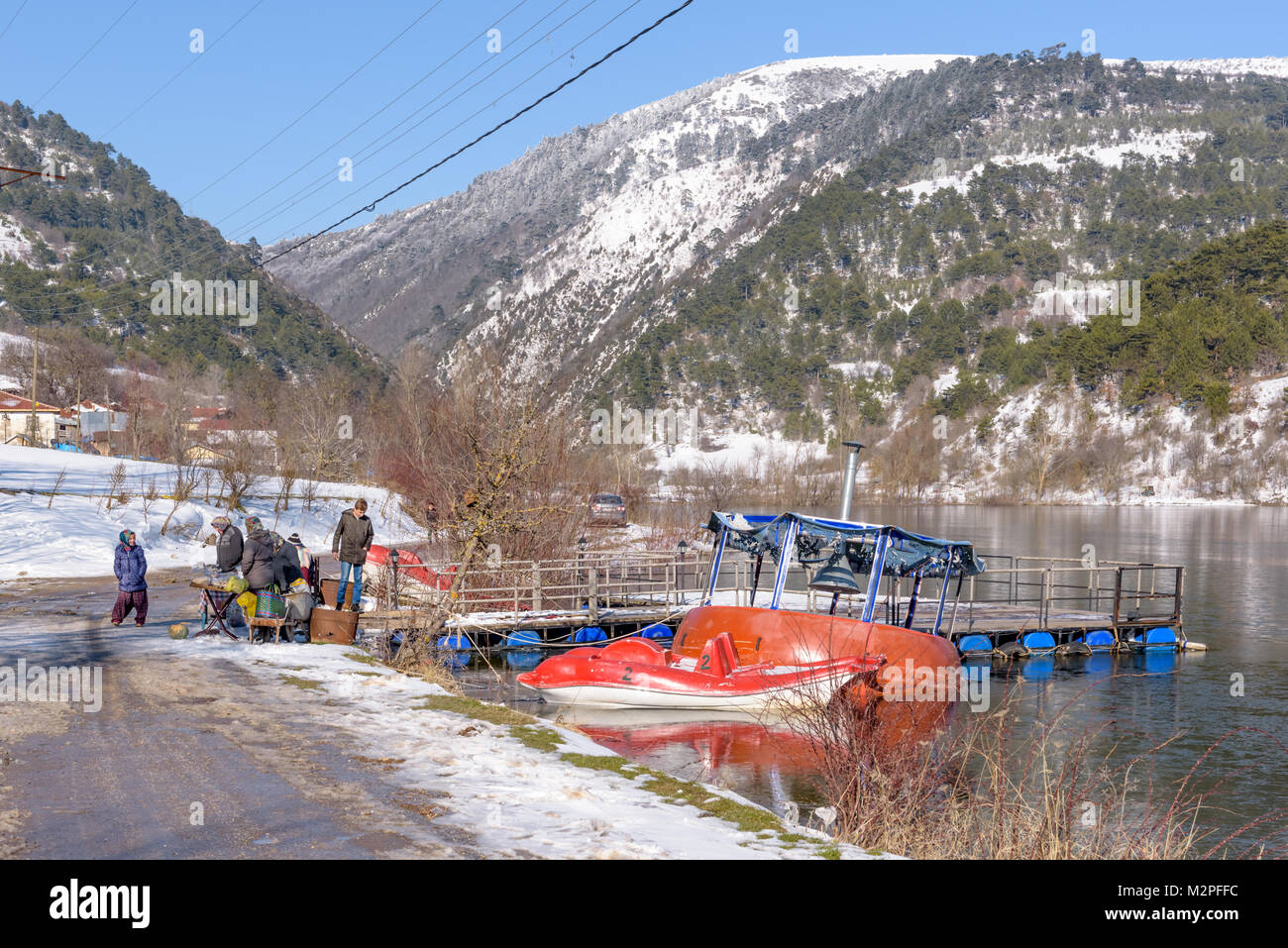 Unidentified Turkish people sell local food near Cubuk lake in Goynuk district,Bolu,Turkey.27 January 2018 Stock Photo