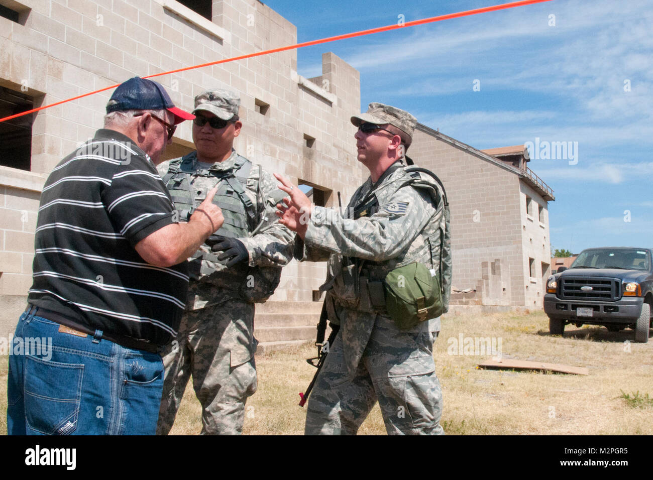 Soldiers and Airmen of the Oklahoma National Guard talk to a role ...