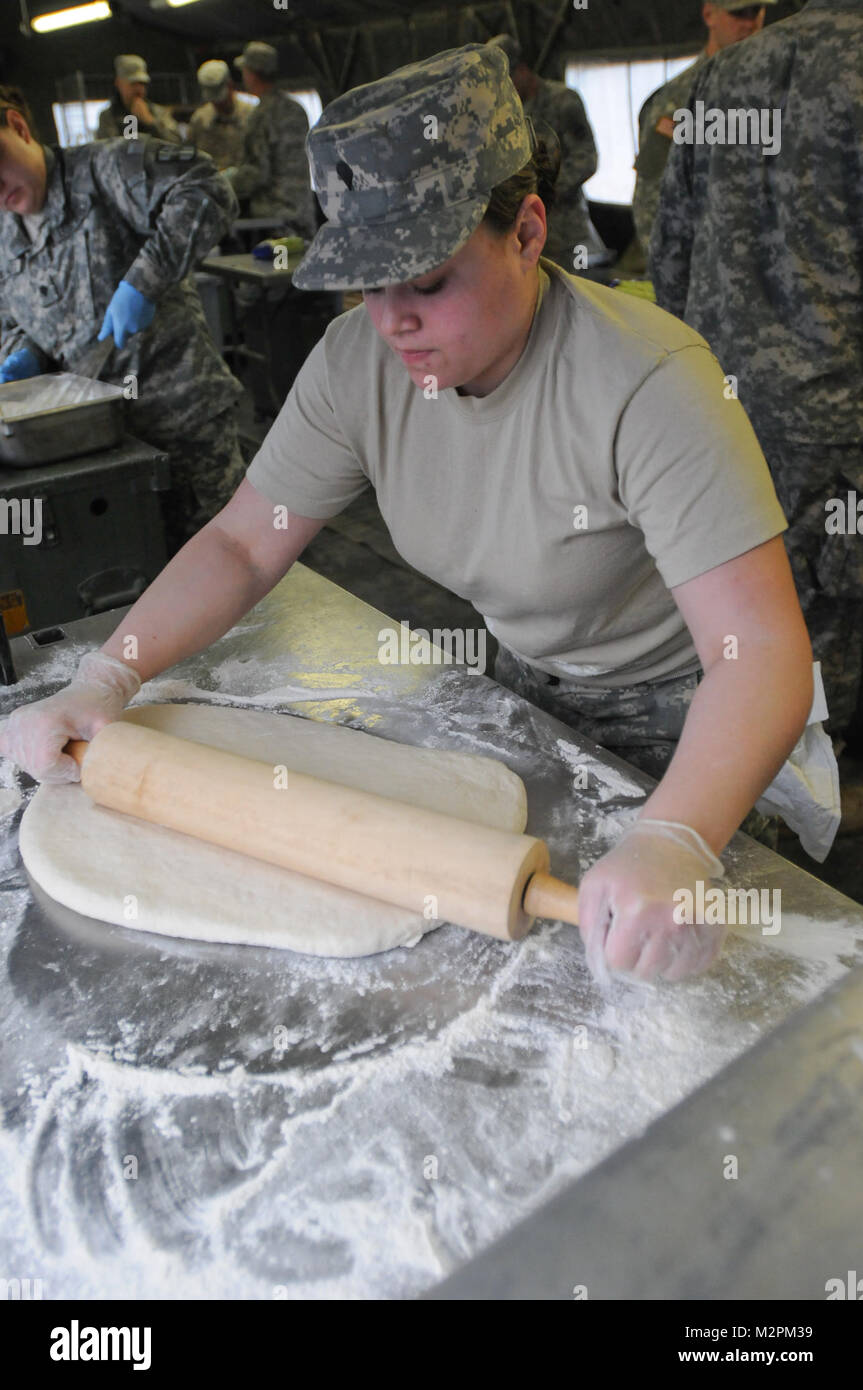 Spc. Isis Salgado of the 452nd Combat Support Hospital rolls dough for shortcake at the U.S. Army Reserve's Connelly Competition at Fort McCoy, Wis., on April 9.  (Photo by Maj. Matt Lawrence, 807th MDSC Public Affairs) 20110409-DSC 2645 by 807MCDS Stock Photo