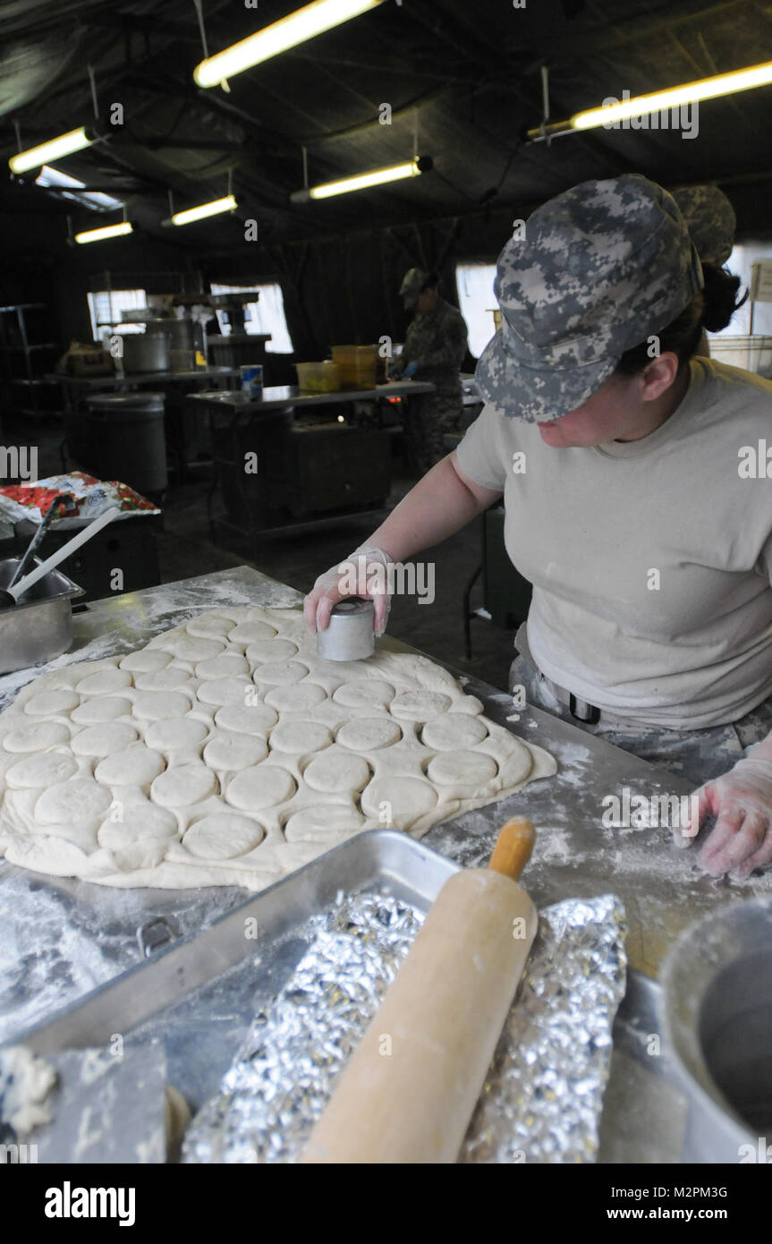 Spc. Isis Salgado of the 452nd Combat Support Hospital cuts the shortcake dough at the U.S. Army Reserve's Connelly Competition at Fort McCoy, Wis., on April 9.  (Photo by Maj. Matt Lawrence, 807th MDSC Public Affairs). 20110409-DSC 2710 by 807MCDS Stock Photo