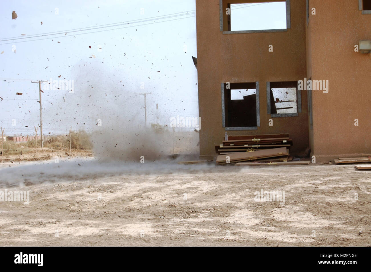 Engineers with C Company, Special Troops Battalion, 2nd Brigade, 1st Infantry Division, United States Division – Center detonate a silhouette charge to breach a door during training at a range at Camp Taji, Iraq, April 20, 2011. The Soldiers spent the day running through the scenario multiple times as dry fire and live fire exercises, implementing different charges each time. (U.S. Army photo by Spc. William K. Ermatinger, 2nd AAB, 1st Inf. Div., USD-C) Dry fire and live fire exercises, by United States Forces - Iraq (Inactive) Stock Photo