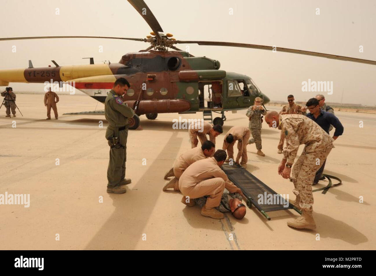 IRAQ, BIAP. Joint MEdevac training at BIAP between the Iraqi Air Force 2nd and 4th Squadron (UH-1, Mi17) crewmembers with 171 GSAB's C Co 3-126 Medevacs crew, and a A Co UH-60 Blackhawk crew flew to BIAP where the Iraqi's trained themselves Medevac procedures, and the US demonstrated to Iraqi's their Medevac equipment on the 'M' model UH-60 MEDEVAC helicopter.  US Airforce personnel facilitated the training at BIAP and participated in the training as well. (Photos by SPC Michael Uribe, 171 GSAB HHC Co.) Contact Michael@imageacquisitions.com Iraqi Air Force by United States Forces - Iraq (Inact Stock Photo