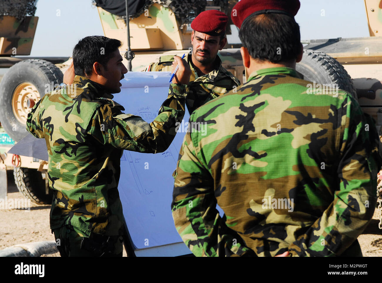 Iraqi Army 2nd Lt. Muhannad Saadi Tayeh, left, with the 17th Iraqi Army