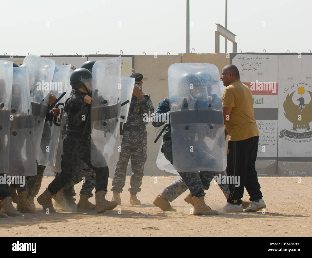BAGHDAD -- Ministry of Interior Iraqi Federal Police perform a riot control demonstration in the civil disorder management course at Camp Dublin Aug 20. Civil Disorder Management graduation at Camp Dublin by United States Forces - Iraq (Inactive) Stock Photo
